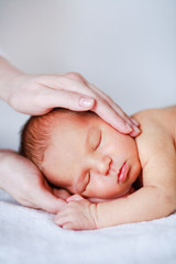 adorable newborn baby in mother's hand