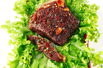 red beef meat on green salad