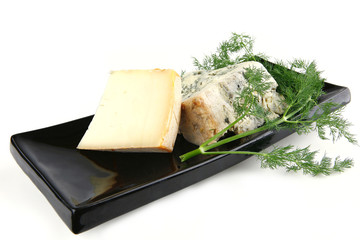 french aged cheeses on black