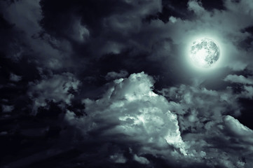 Naklejka premium magic moon over the clouds