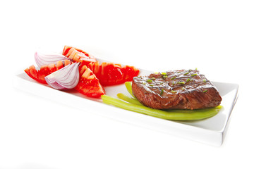 roast meat served with tomato