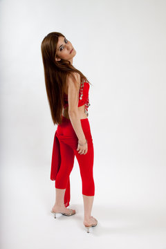 Pretty belly dancer with a red scarf