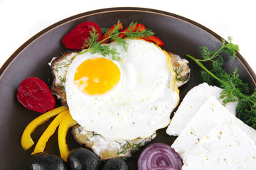 fried egg on dark dish