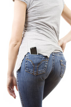 Woman's Bottom With Phone In The Pocket On White Background