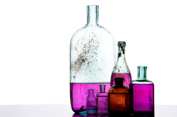 colorful liquid on antique bottles