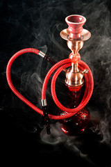 Red hookah on a black background