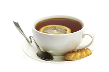 white cup, a spoon and a lemon isolated on white
