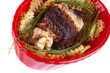 roast meat in red bowl