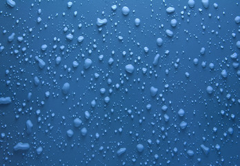 Water drops on blue surface
