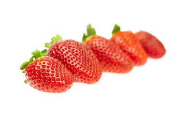 juicy strawberries isolated on white