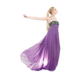 studio shot of beautiful woman in long purple dress