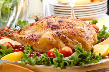 Whole roasted chicken on table