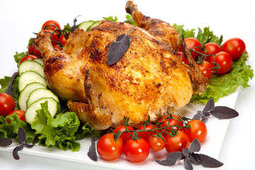 Whole roasted chicken on white