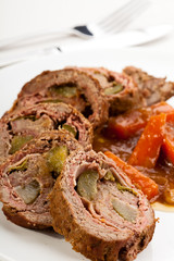 Roasted, stuffed pork chop with chips and vegetables