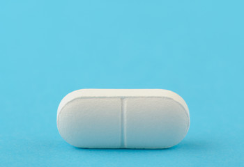 White tablet on a blue background.