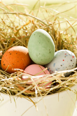 Naklejka na ściany i meble Easter chocolate eggs in the nest.