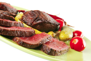 red beef slices on green dish