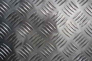 Detail of a new grid of steel placed along a road