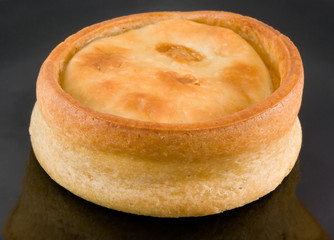 scotch pie on black background