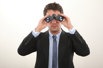 Business Mann mit Fernglas