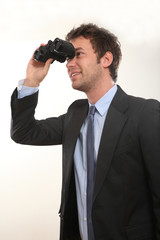 Business Mann mit Fernglas