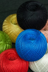 Reels with threads of different colors.