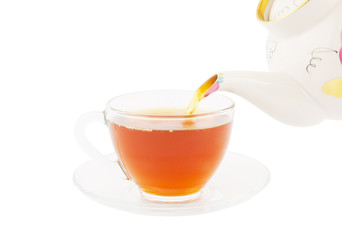 Black tea pouring isolated on white background