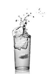 water splash in glass isolated on white