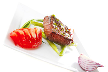roast fillet served with tomato