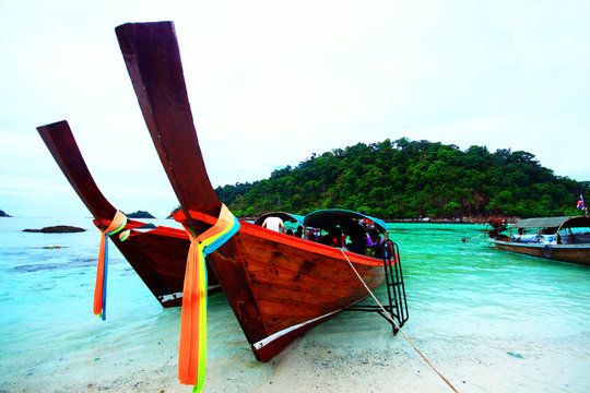 Boat and rock near tropical island
