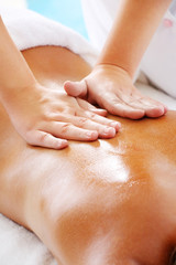 Massage Techniques II - woman receiving professional massage.