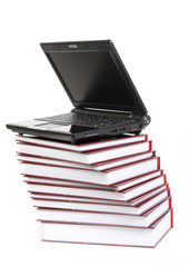 Laptop on a stack of books