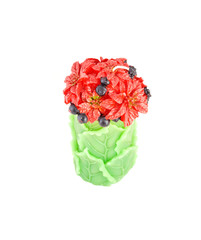 Candle in shape of bouquet of flowers on white