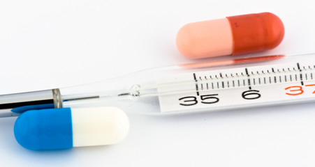Pills and thermometer