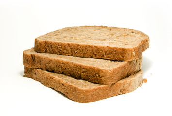 Three slices of brown bread isolated on white background