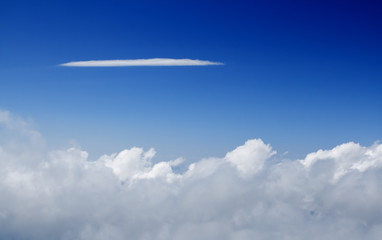 Fototapeta premium Blue sky with long tiny cloud to put your text on