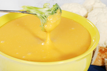closeup of cheese fondue with broccoli