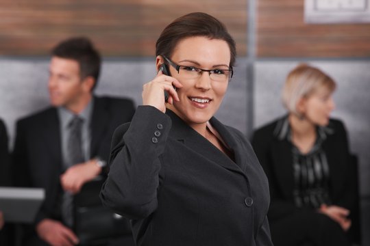 Mid-adult businesswoman talking on mobile