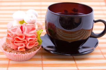 Cupcakes on the orange napkin and tea