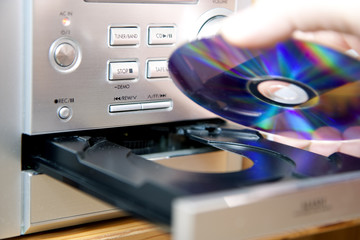 Loading or putting CD into player