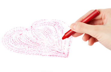 Hand with wax crayon drawing heart