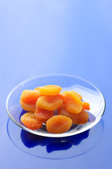 Dried apricots on plate