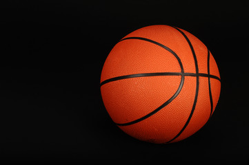 Basketball on black background ready for your type.