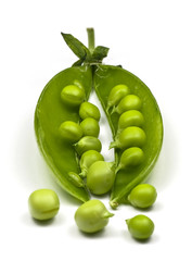 Fresh green peas on white