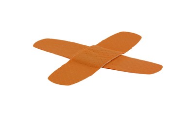 Two adhesive bandages in a cross, isolated on pure white