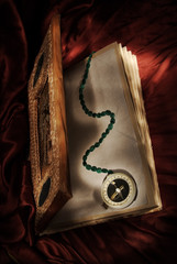Magic book with wizard  compass