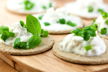 Canapes with fresh cheese and herbs