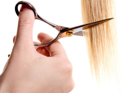 scissors cutting lock of hair