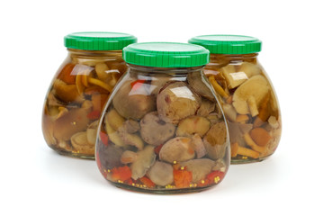 Glass jars with marinated mushrooms