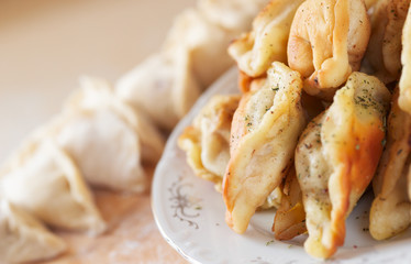 Fried and uncooked ravioli